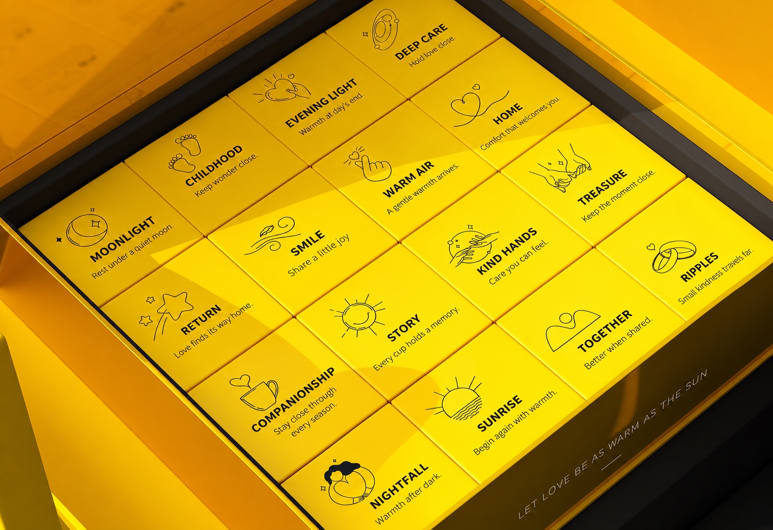 Open yellow ginger tea gift box containing neatly organized individual cartons